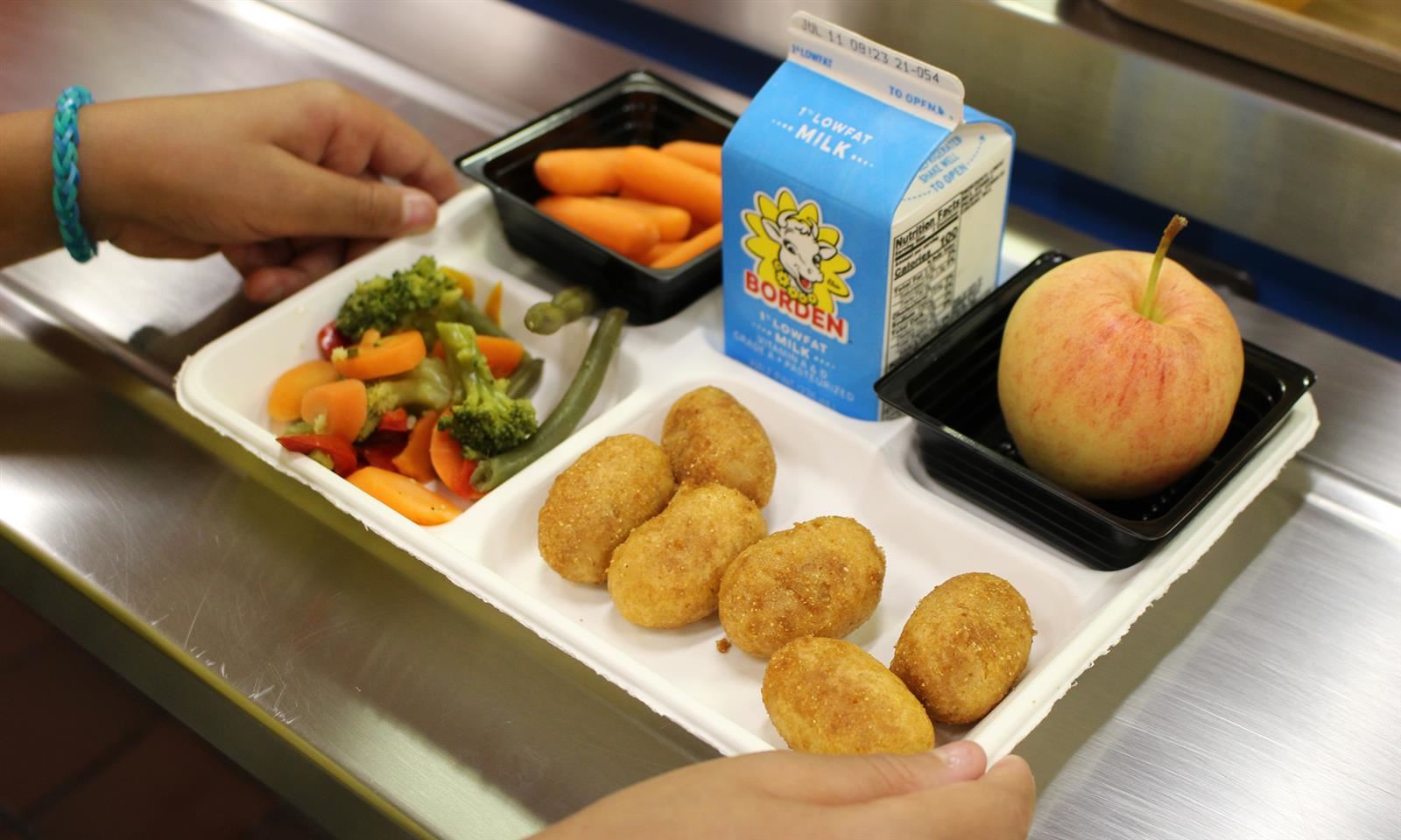 A school lunch tray filled with food